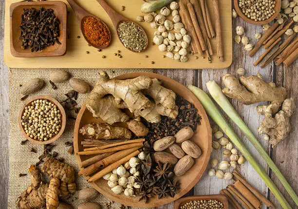Chinese herbs and spices arranged on a wooden table